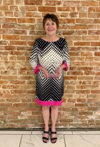 Photo of Diane Addison, the Hannibal Chamber's 2026 Pacesetter award recipient, holding her plaque